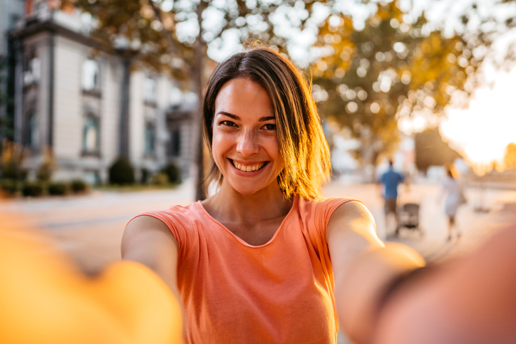 Smiling woman making selfie