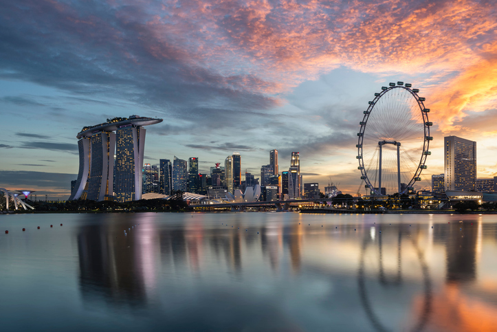 Reflection Of Buildings In City At Sunset