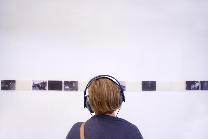 Young woman looking at exhibition